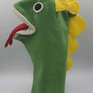 May include: A white ceramic mug with a black handle and the text "But First, Coffee" in a handwritten style. The mug is on a white surface. The mug is approximately 4 inches tall.