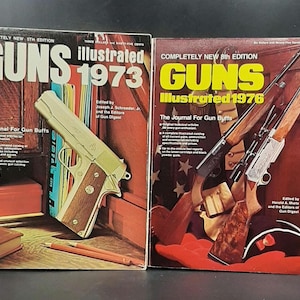 May include: Two vintage copies of Guns Illustrated magazine. The first is the 5th edition from 1973 and features a handgun on the cover. The second is the 8th edition from 1976 and features a rifle on the cover. Both magazines have red, white, and blue covers.