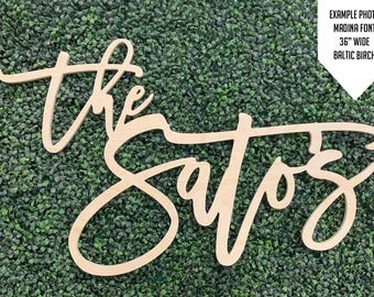 May include: The Sattiz, a wooden sign with the text "The Sattiz" in a cursive font. The sign is 36 inches wide and made of Baltic birch.
