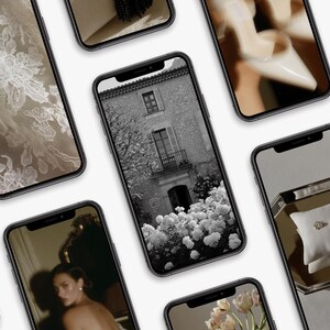 May include: A collection of smartphones displaying various images. The screens showcase a range of subjects, including a black and white building, a close-up of lace, a woman, and a pair of rings on a pillow. The overall aesthetic is elegant and sophisticated.