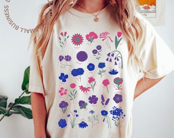 May include: A white t-shirt with a design of blue and pink flowers with their names printed below each flower. The text "march movement" and "ORIGINAL DESIGN" is printed at the bottom of the shirt.
