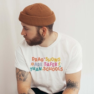 Drag Shows Are Safer Than Schools Shirt | Drag is Not a Crime | March For The Movement | Protest Shirt | LGBTQ Rights Shirt | LGBTQ Gift