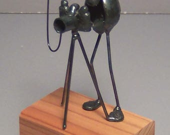 Photographer, camera on tripod