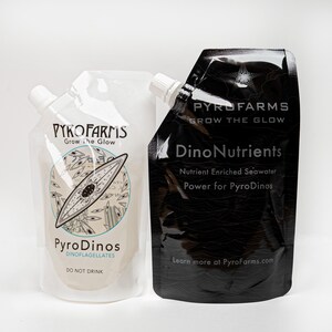 Pyrofarms White Dinoflagellate pouch & Black nutrient pouches against a white background.