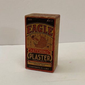 May include: A vintage box of Eagle Patching Plaster, size No. 3, manufactured by Williams Stove Lining Co. in Taunton, Mass. The box is brown with red and black lettering and a picture of a man patching a wall. The box contains 2 1/2 lbs of plaster.