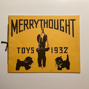May include: A vintage "Merrythought Toys 1932" catalog cover. The cover is yellow with black text and illustrations of a rabbit, dog, and cat. The rabbit is holding a toy. The catalog is bound with a black string.