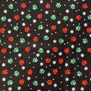 Paw Print Flannel Fabric: Red, Green, and White on Black