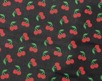 May include: Black fabric with a repeating pattern of red cherries and green leaves. The cherries are clustered in pairs and triplets, creating a playful and summery design. This fabric is suitable for various sewing projects.