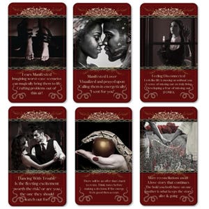 May include: A set of six tarot cards with a dark red border and ornate scrollwork. Each card features a different image and text. The images include couples, a snake and apple, and a person holding a candle. The text on the cards offers guidance.