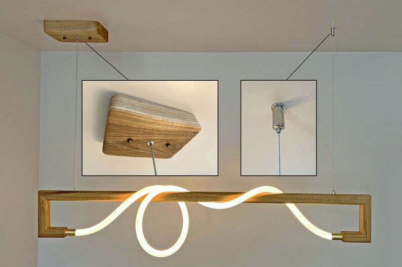 May include: A modern wooden light fitting with a curved LED light strip. The light is suspended from the ceiling by a thin cable and has a wooden canopy.
