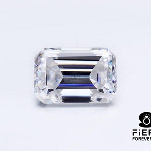 May include: A clear emerald cut diamond with a fiery brilliance. The diamond is set in a simple setting and is perfect for a ring or pendant.