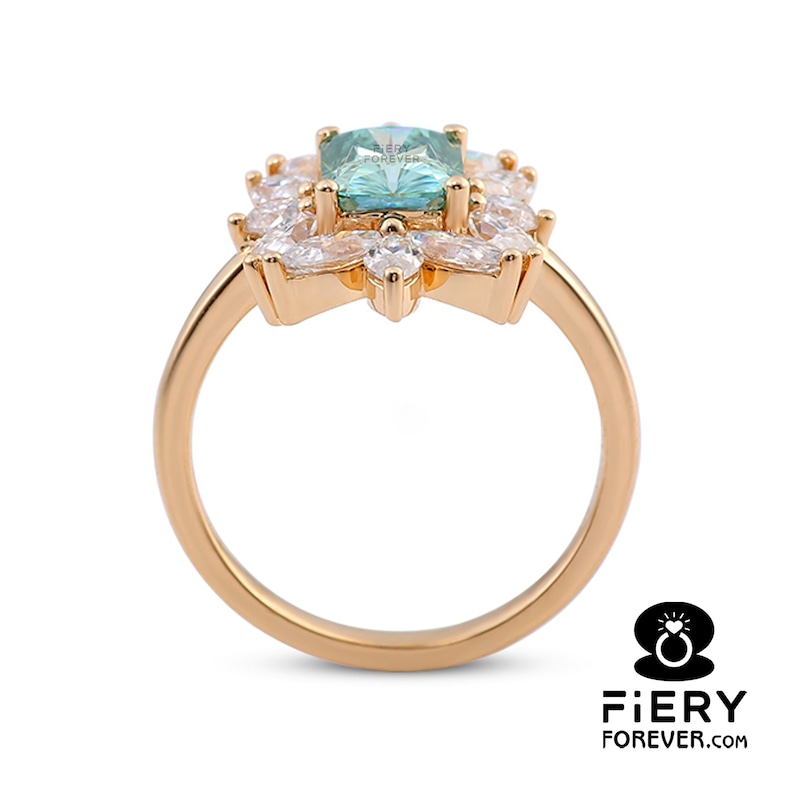 May include: A gold ring with a large, square, light blue gemstone surrounded by smaller, clear gemstones. The ring has a delicate, floral design.