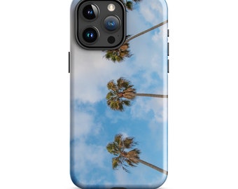 May include: A phone case with a design of palm trees against a blue sky with white clouds.