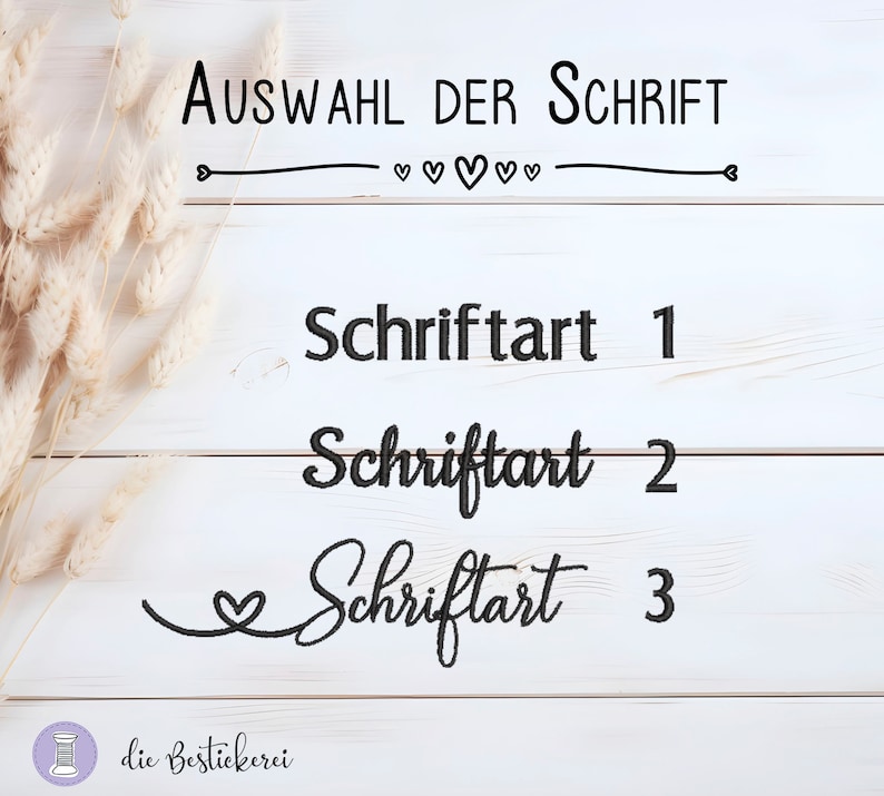 May include: A white wooden background with three different font styles displayed. The text reads "Auswahl der Schrift" with hearts and a line underneath. The text below reads "Schriftart 1", "Schriftart 2", and "Schriftart 3".