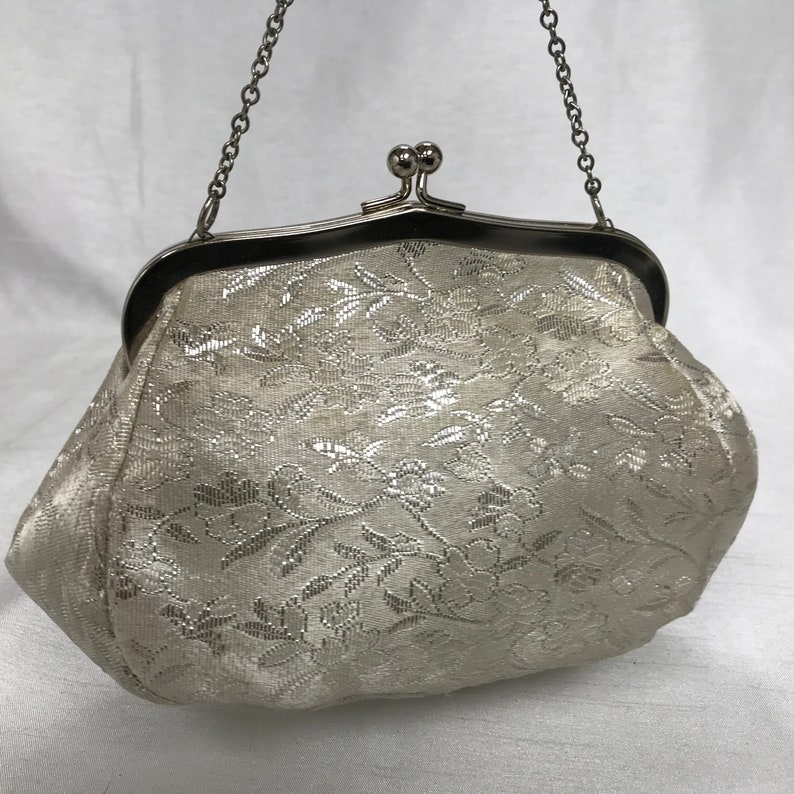 White and silver vintage handbag