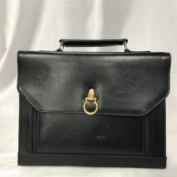 Black leather bag, black leather towel, black brie