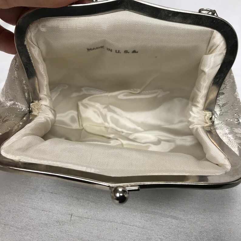 White and silver vintage handbag