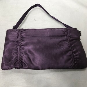 Purple vintage envelope style handbag