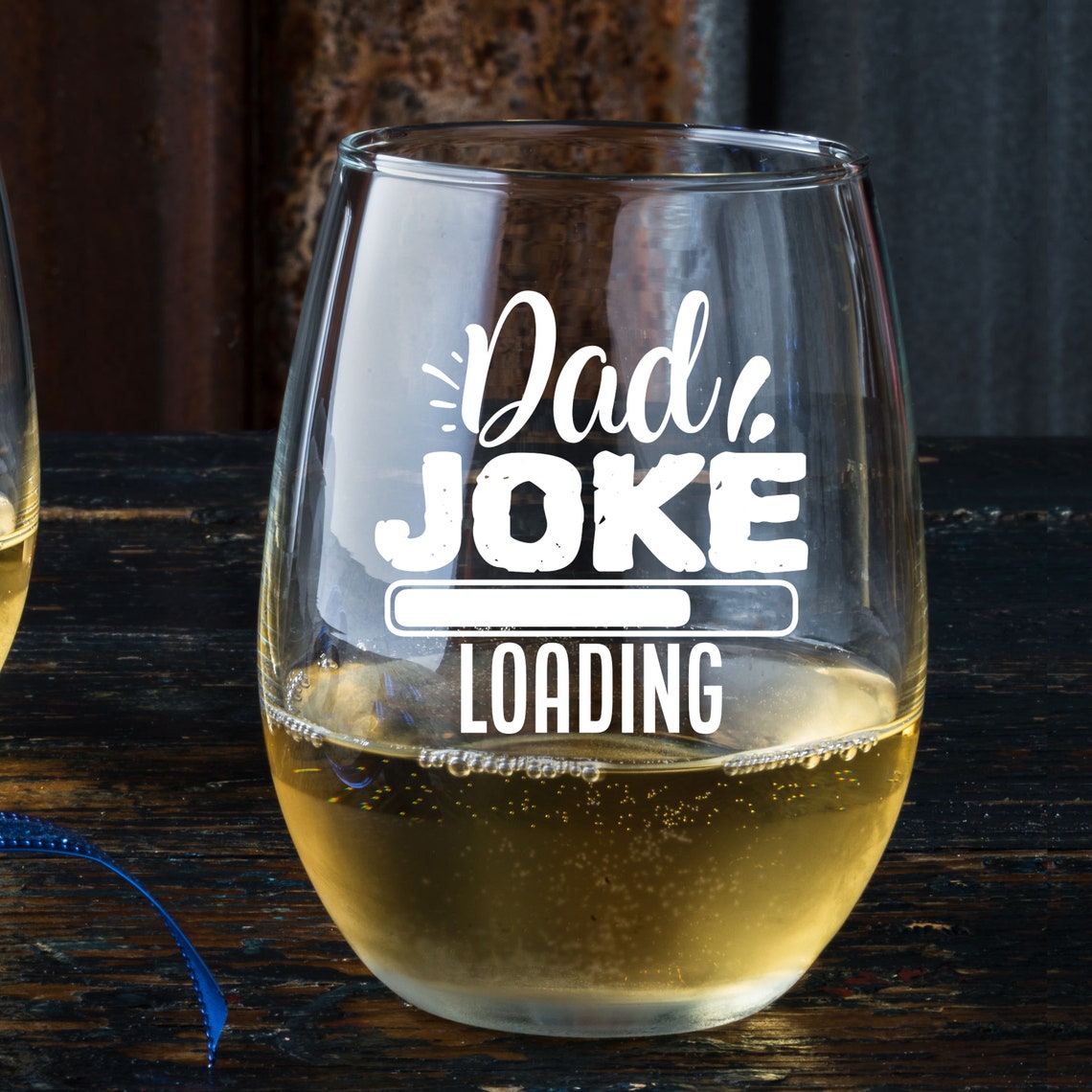 This stemless wine glass features a funny quote "Dad Joke Loading". It definitely adds a new flavor to his drink.