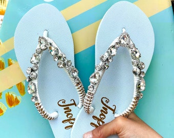 Set of 6 pairs of white bridal sandals.