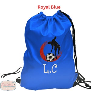 May include: Royal blue drawstring bag with a red and black football player design and the initials "L.C." embroidered on the front.