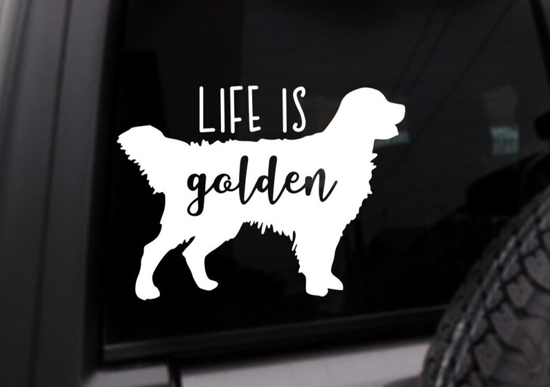 May include: White vinyl decal with a silhouette of a golden retriever and the text "Life is golden".