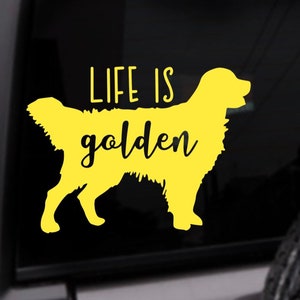 May include: Yellow vinyl decal of a golden retriever with the text "Life is golden" on a black background.