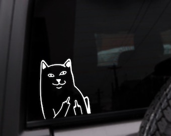 May include: A black and white sticker of a cat giving the middle finger. The cat is outlined in white and has a black filled-in body. The sticker is on a black car window.
