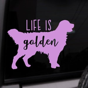 May include: A purple vinyl decal with the silhouette of a golden retriever and the text "Life is golden".