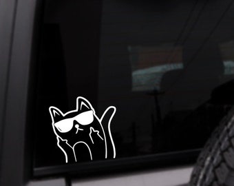May include: A white vinyl sticker of a black cat wearing sunglasses and giving the middle finger. The cat is facing the right side of the image.