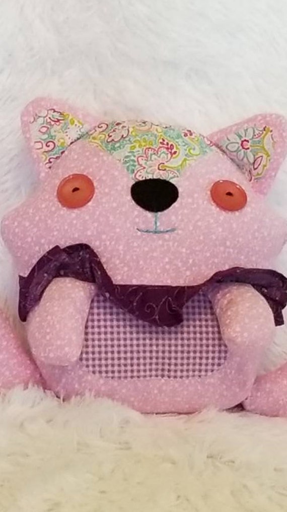 pink raccoon stuffed animal