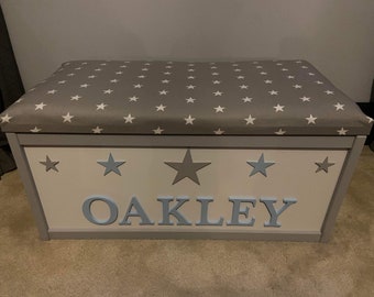 Personalised toy box with lift off lid, can be used as a seat, lovely gift or nursery furniture/blanket box. Add your child's name.
