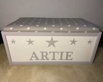 Large personalised toy box with safety gas strut. Padded star lid seat, blanket storage or toy storage. Hinged lid, ideal baby gift.