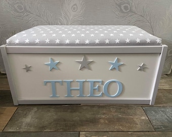 Large personalised toy box with safety gas strut. Padded star lid seat, blanket storage or toy storage. Hinged lid, ideal baby gift.