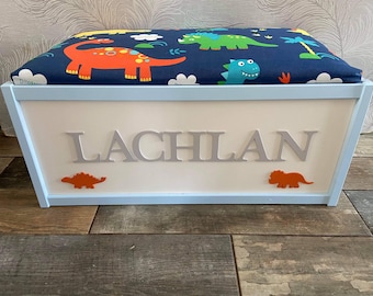 Personalised toy box with safety gas strut.