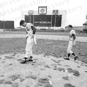 Tom Seaver and Gary Gentry survey the aftermath of their 1969 World Series Win....With their Cigars in tow.