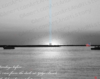 May include: A black and white photograph of a boat with an American flag on the back, on a body of water with two tall buildings in the distance. The caption reads "2 Sundays before... The view from the dock at Gilgo Beach. Little did we know what was to come..." and "9 2001".