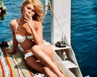 Brigitte Bardot Takes a Toke while in her Bikini