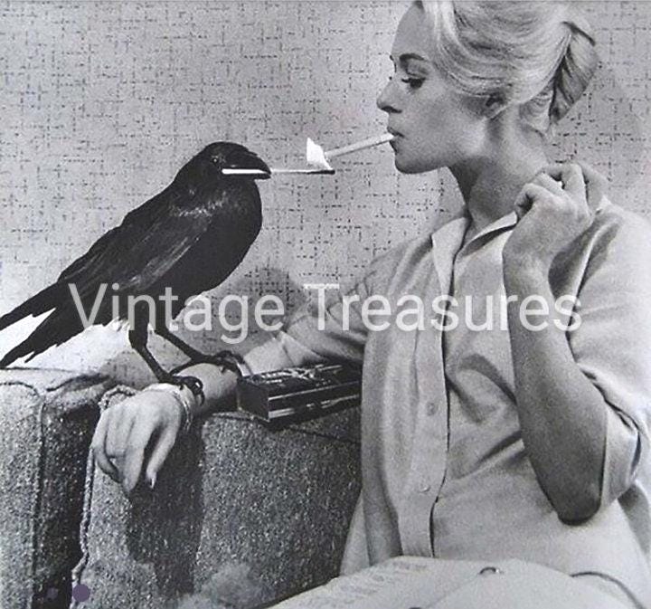 Tippi Hedren Having Her Cigarette Lit By a Crow