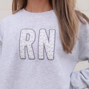 Blue Floral Print Registered Nurse Embroidered Sweatshirt, Embroidered RN Sweatshirt, Nurse Embroidered Shirt, Flower Nurse Sweatshirt