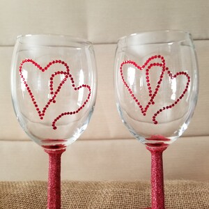 Wine glass set with red hearts done from rhinstones and stem and base in red glitter