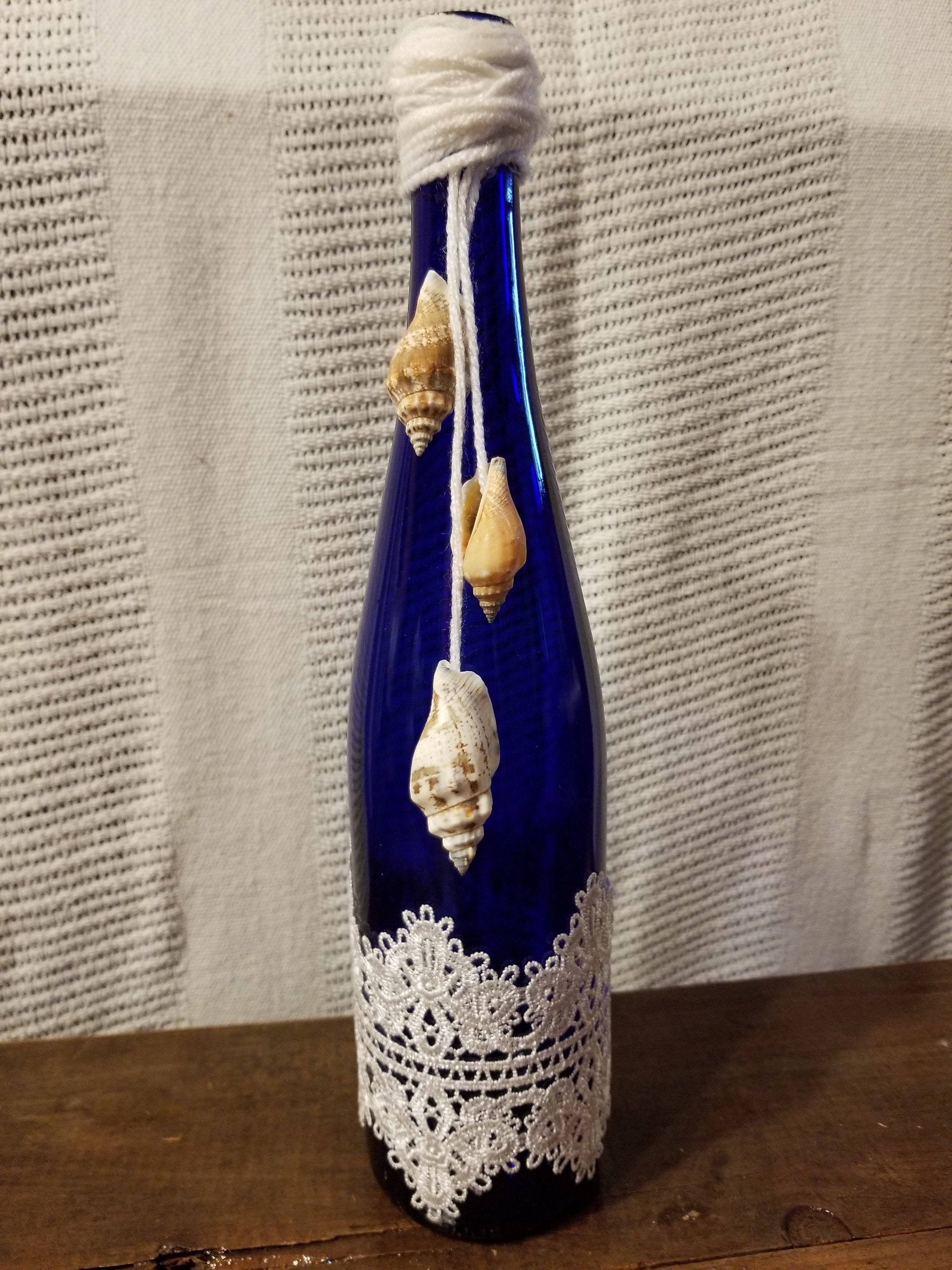 Decorative wine bottle light in blue with lace and shells Etsy