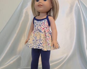 Two-piece outfit has spaghetti strap, flower print top, blue leggings to fit 14.5 inch dolls like Wellie Wishers, Glitter Girls, etc.