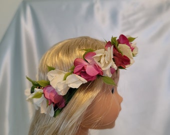 Flower crown has white and pink flowers and fits Wellie Wishers, Glitter Girls and other 14-15 inch dolls.