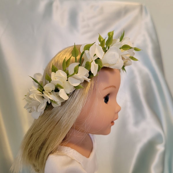 Flower crown has white flowers and fits Wellie Wishers, Glitter Girls and other 14-15 inch dolls.