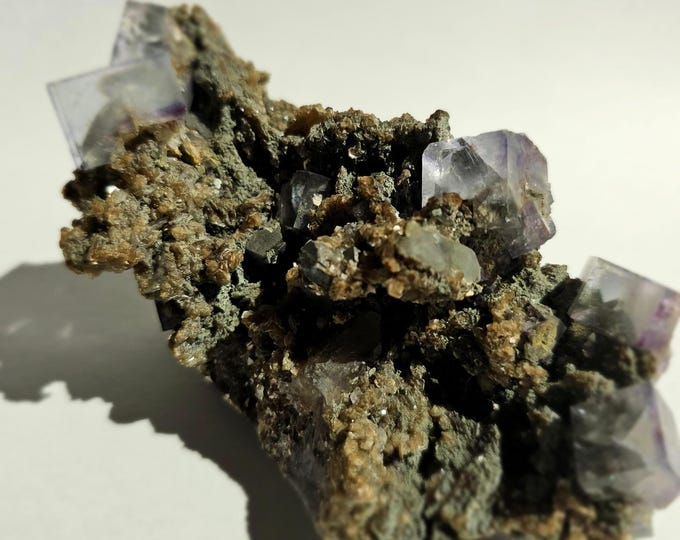 Purple-White Fluorite with Pyrite Green Prasiolite and Black Tourmaline from Dalnegorsk, Russia.
