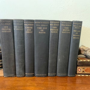 Vintage, First Editions of “The Story of Civilization Books” by Will Durant. Volumes II-VII, not a complete set. Black and Gold Hardcovers.