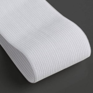 May include: White elastic band with a ribbed texture.