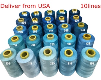 May include: A collection of blue thread spools in various shades, numbered with white digits. The image includes the text "Deliver from USA" and "10lines". The spools are arranged closely together, showcasing a range of blues.