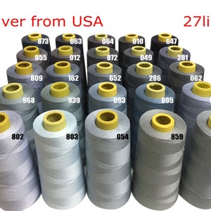 May include: A collection of 27 spools of thread in various shades of gray, blue, and black. The spools are arranged in a triangular pattern and labeled with numbers.
